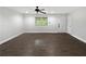 Bright and airy living room with dark hardwood flooring at 4318 Christine Ct, Decatur, GA 30035