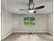 Spacious bedroom with carpeted floors and ceiling fan at 4318 Christine Ct, Decatur, GA 30035