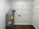 Laundry room with wire shelving and water heater at 4318 Christine Ct, Decatur, GA 30035