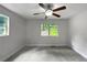 Spacious bedroom with gray carpeting and a large window at 4318 Christine Ct, Decatur, GA 30035