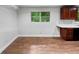 Kitchen features hardwood floors and dark wood cabinets at 4318 Christine Ct, Decatur, GA 30035