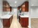 Simple kitchen with light brown cabinets and white countertops at 4318 Christine Ct, Decatur, GA 30035