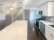 Modern kitchen with white cabinets, quartz countertops and stainless steel appliances at 51 Holt Ne Rd, Marietta, GA 30068