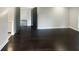 Main bedroom with dark hardwood floors and access to bathroom at 51 Holt Ne Rd, Marietta, GA 30068