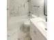 Clean bathroom with marble tile and updated fixtures at 51 Holt Ne Rd, Marietta, GA 30068