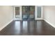 Sunlit living area with dark hardwood floors and French doors at 51 Holt Ne Rd, Marietta, GA 30068