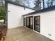 Private patio with concrete flooring and leafy trees at 51 Holt Ne Rd, Marietta, GA 30068