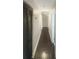 Long hallway with dark hardwood floors and neutral walls at 51 Holt Ne Rd, Marietta, GA 30068