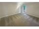 Well-lit bedroom featuring carpet flooring and a window at 51 Holt Ne Rd, Marietta, GA 30068