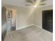 Bright bedroom with carpet flooring, ceiling fan and spacious closet at 51 Holt Ne Rd, Marietta, GA 30068