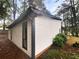White house exterior with black accents and landscaping at 51 Holt Ne Rd, Marietta, GA 30068