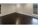 Large living room with dark hardwood floors and large windows at 51 Holt Ne Rd, Marietta, GA 30068