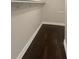 Walk-in closet with dark hardwood floors and shelving at 51 Holt Ne Rd, Marietta, GA 30068