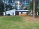 Modern exterior with white siding and wood accents at 51 Holt Ne Rd, Marietta, GA 30068