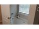 Bathroom with soaking tub and window at 3364 Joseph Nw Dr, Acworth, GA 30101
