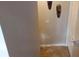A narrow hallway with tile flooring and neutral walls at 3364 Joseph Nw Dr, Acworth, GA 30101