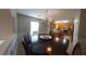 Spacious dining area with a large table and chandelier at 3364 Joseph Nw Dr, Acworth, GA 30101