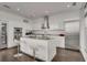 Modern white kitchen with stainless steel appliances and large island at 45 Ivan Allen Jr Nw Blvd # 2705, Atlanta, GA 30308