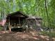 One-story house with porch and wooded setting at 2576 E Paulding Dr, Dallas, GA 30157
