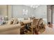 Bright dining area with wood table and neutral-toned chairs at 2555 Flat Shoals Rd, South Fulton, GA 30349