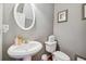 Simple and clean bathroom with white pedestal sink and toilet at 2555 Flat Shoals Rd, South Fulton, GA 30349