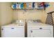 Laundry room with washer, dryer, and shelving at 2555 Flat Shoals Rd, South Fulton, GA 30349