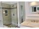 Stylish bathroom with a glass-enclosed shower, modern fixtures, and tiled walls at 301 Ashbourne Trl, Lawrenceville, GA 30043