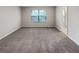 Bright bedroom with plush carpeting and an adjoining bathroom at 6756 Blackstone Pl # 6, Mableton, GA 30126