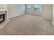 Bright living room featuring a fireplace and plush carpeting at 6756 Blackstone Pl # 6, Mableton, GA 30126