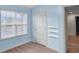Light blue bedroom with wood-look floors and built-in shelves at 3203 Puritan Way, Mcdonough, GA 30252