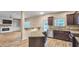 Open kitchen with granite island, stainless steel appliances, and backyard access at 3203 Puritan Way, Mcdonough, GA 30252