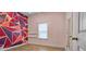 Bedroom with geometric accent wall and wood-look floors at 3203 Puritan Way, Mcdonough, GA 30252