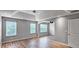 Spacious bedroom featuring a tray ceiling and hardwood floors at 3203 Puritan Way, Mcdonough, GA 30252