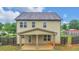 Two-story home with covered back patio at 3203 Puritan Way, Mcdonough, GA 30252