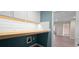 Laundry room with wood countertop, shiplap wall, and built-in cabinets at 3203 Puritan Way, Mcdonough, GA 30252