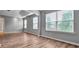 Bright bedroom with wood-look floors and multiple windows at 3203 Puritan Way, Mcdonough, GA 30252