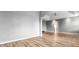 Open living room with hardwood floors and access to other rooms at 3203 Puritan Way, Mcdonough, GA 30252