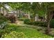 Landscaped garden with stone pathway, lush greenery at 9170 Selborne Ln, Chattahoochee Hills, GA 30268