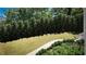 Landscaped backyard with lush greenery and a winding walkway at 3483 Conley St, College Park, GA 30337