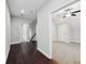 Spacious hallway with dark hardwood floors and access to bedrooms at 3483 Conley St, College Park, GA 30337