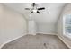 Spacious bedroom with carpet, ceiling fan, and window with shutters at 3483 Conley St, College Park, GA 30337