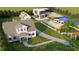 Aerial view of a property with multiple buildings, a pool, and a tennis court at 3483 Conley St, College Park, GA 30337