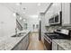 Modern kitchen with gray cabinets and granite countertops at 3483 Conley St, College Park, GA 30337