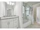 Clean bathroom with white vanity, granite countertop, and bathtub at 3483 Conley St, College Park, GA 30337