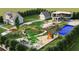 Aerial view of a house and expansive backyard with a playground and pool at 3483 Conley St, College Park, GA 30337