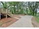 Backyard with concrete pad, basketball court, and trees at 3483 Conley St, College Park, GA 30337
