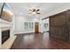 Living room with hardwood floors, fireplace, and barn door at 3483 Conley St, College Park, GA 30337