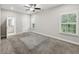 Spacious bedroom with carpet, ceiling fan, and window with shutters at 3483 Conley St, College Park, GA 30337