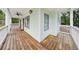 Front porch with wooden flooring and white railing at 3483 Conley St, College Park, GA 30337