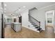 Elegant staircase with dark wood treads and a white railing at 3483 Conley St, College Park, GA 30337